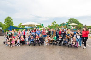 Group photo of Little Light House families and staff using the Zoo as their classroom.